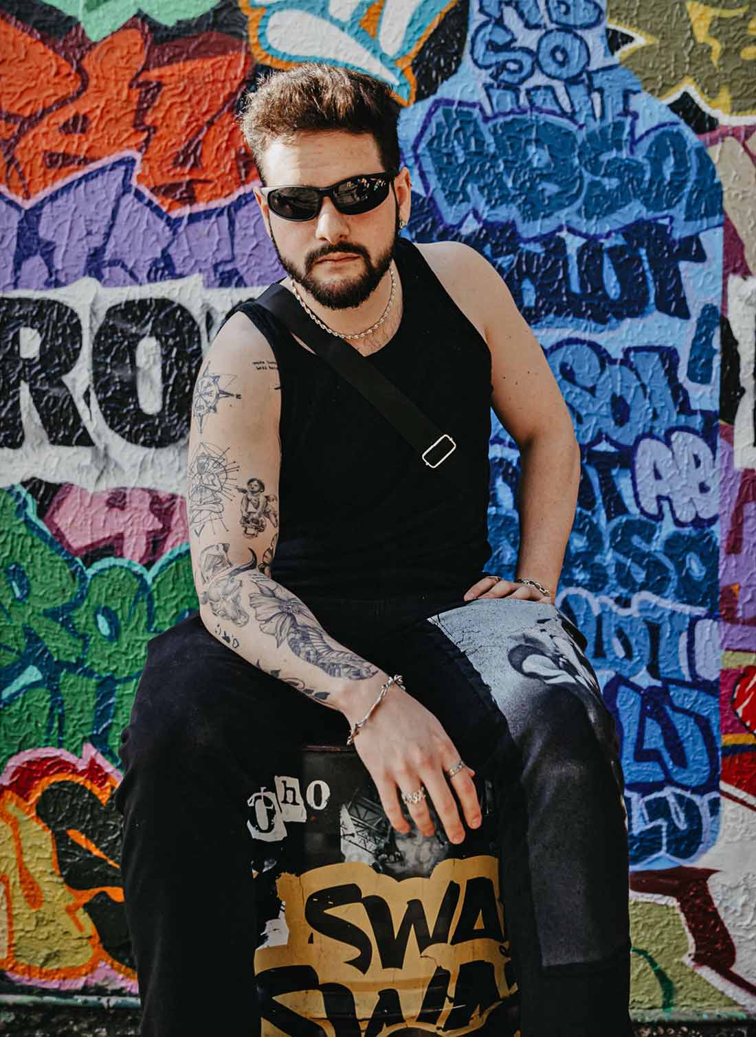 Man with Sunglasses and Tattooed Arm Man with Sunglasses and Tattooed Arm